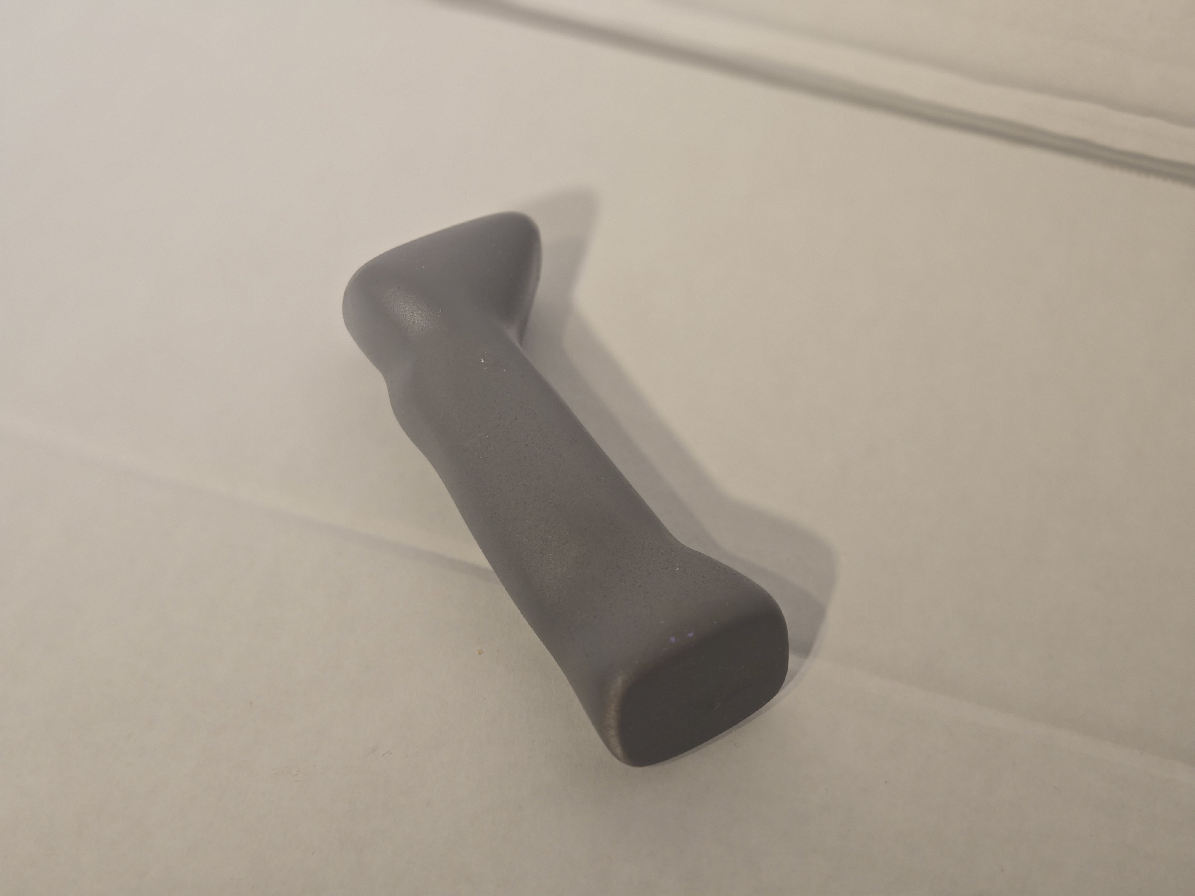 DONE. injection-molded handle — gray prototype form check at production scale