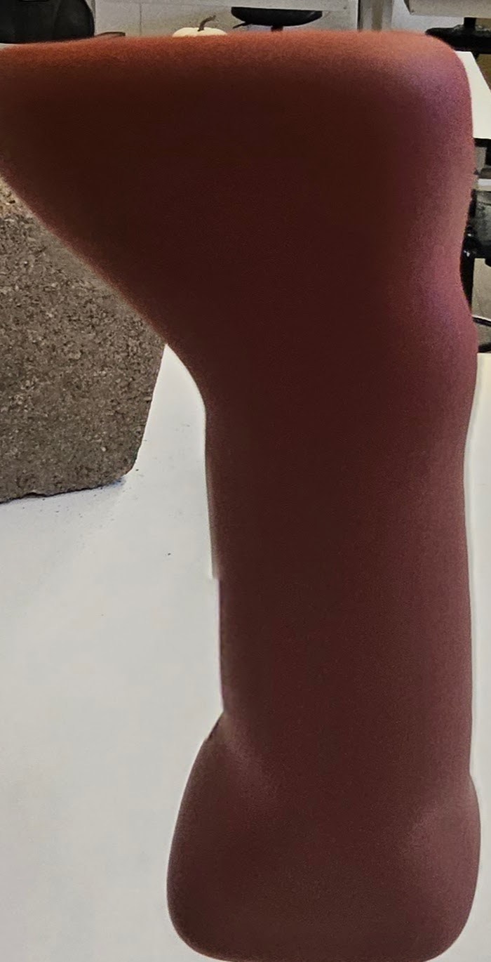 DONE. final foam model — side profile showing the handle-to-head transition and ergonomic waist