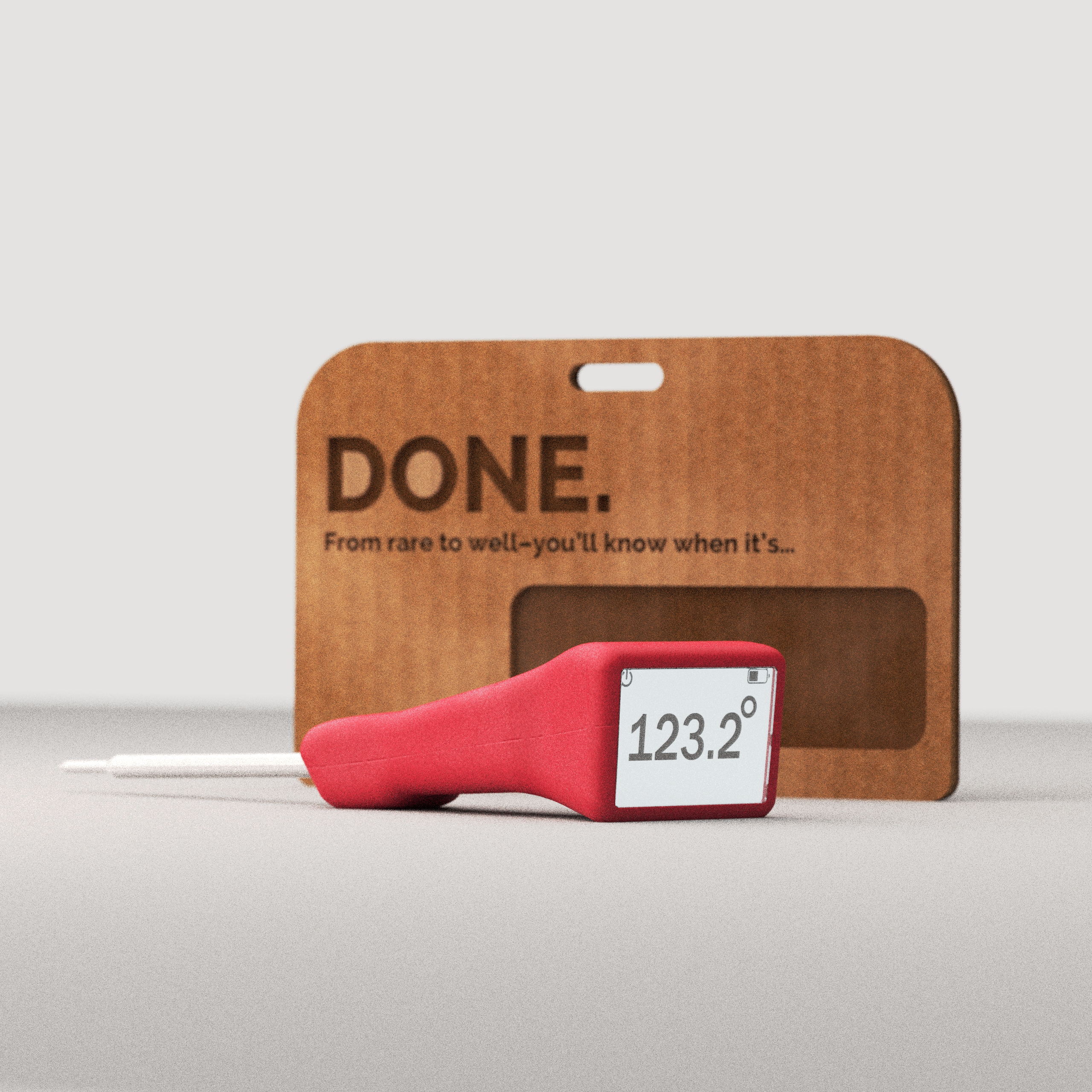 DONE. product and packaging — red thermometer in front of kraft hang card, square display reading 123.2°