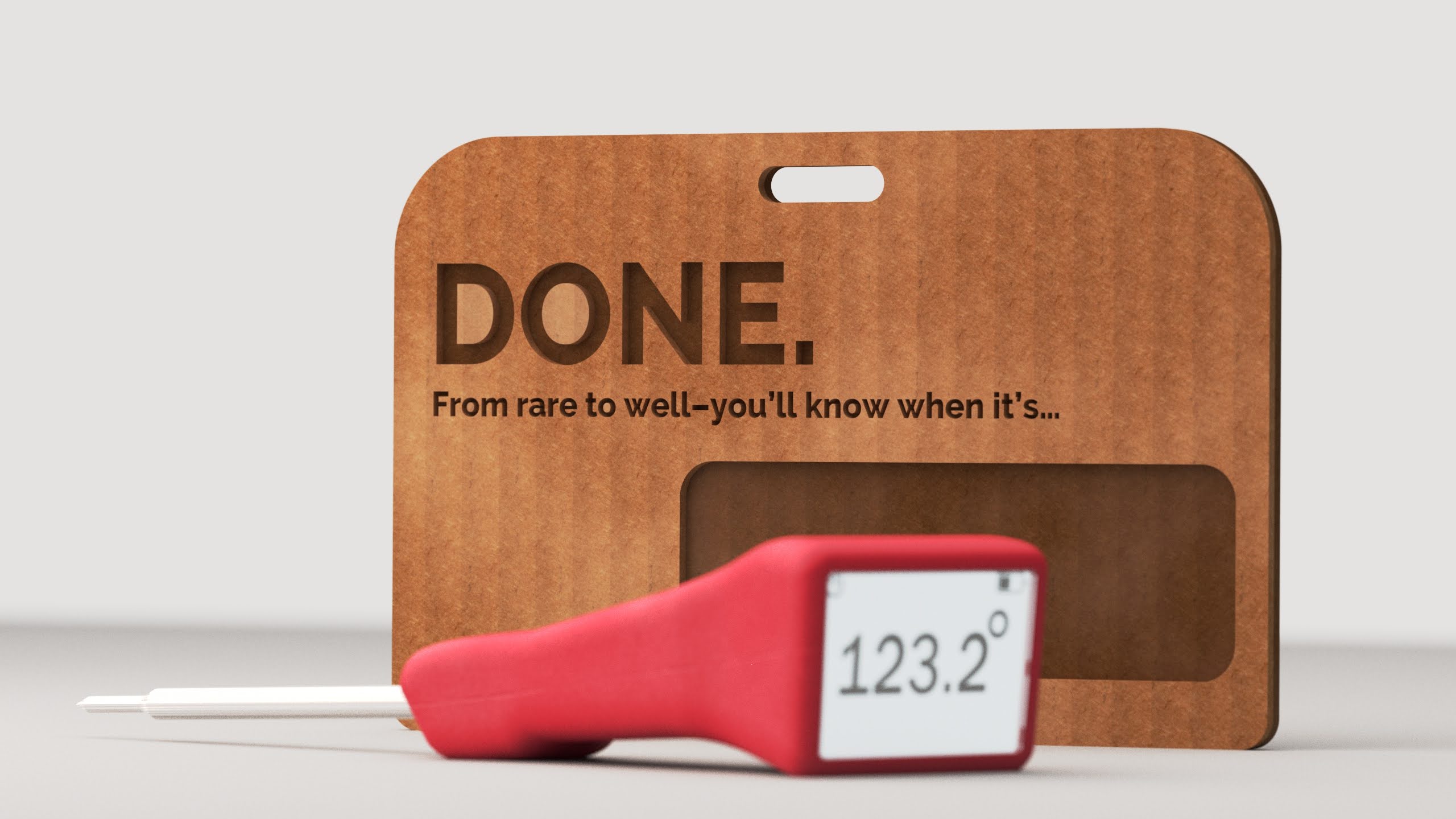 DONE. red thermometer lying flat in front of the kraft hang card — 'DONE. From rare to well — you'll know when it's...' set in bold type over the warm kraft surface