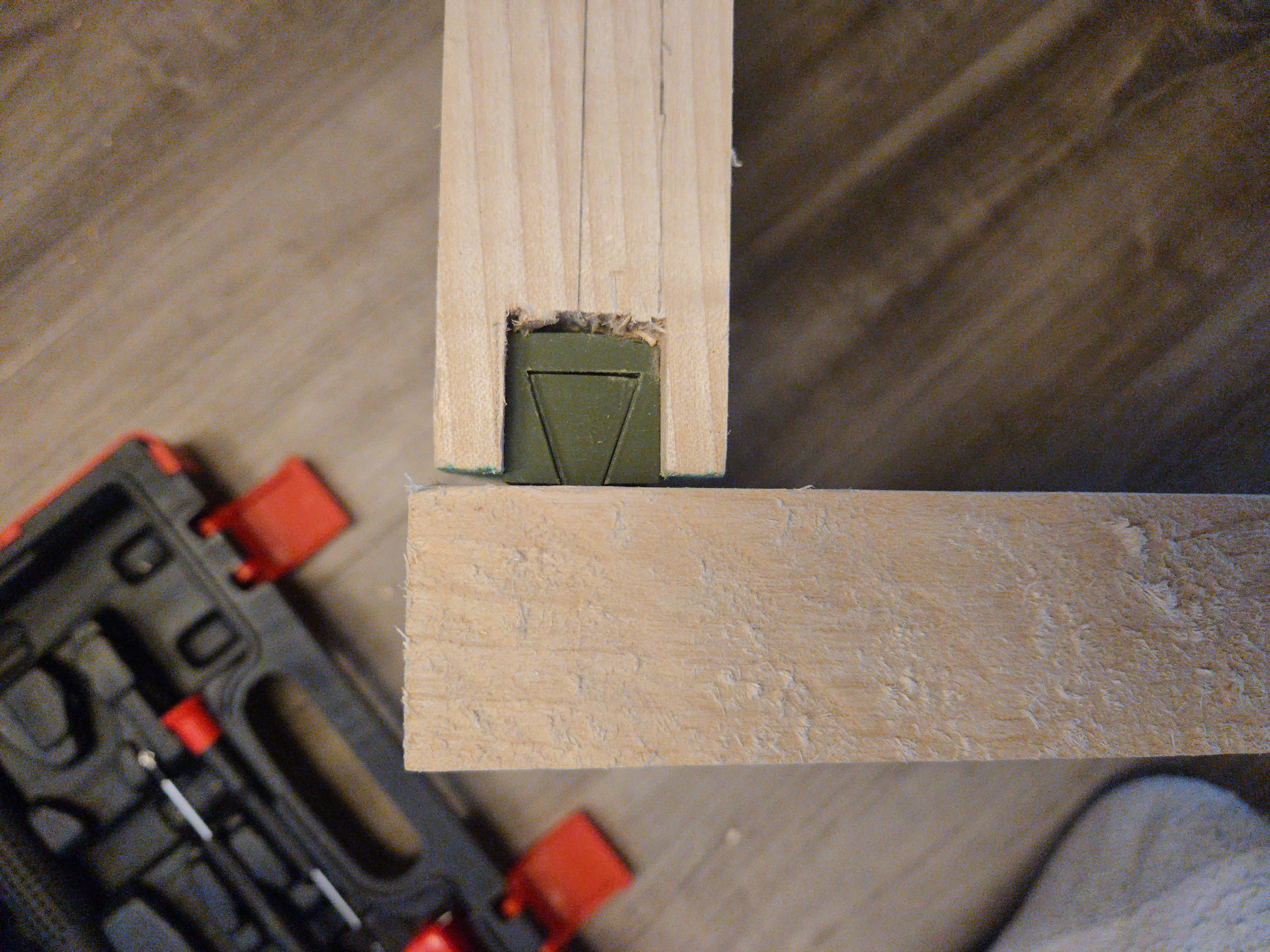 Dovetail bracket fitted into wood joint