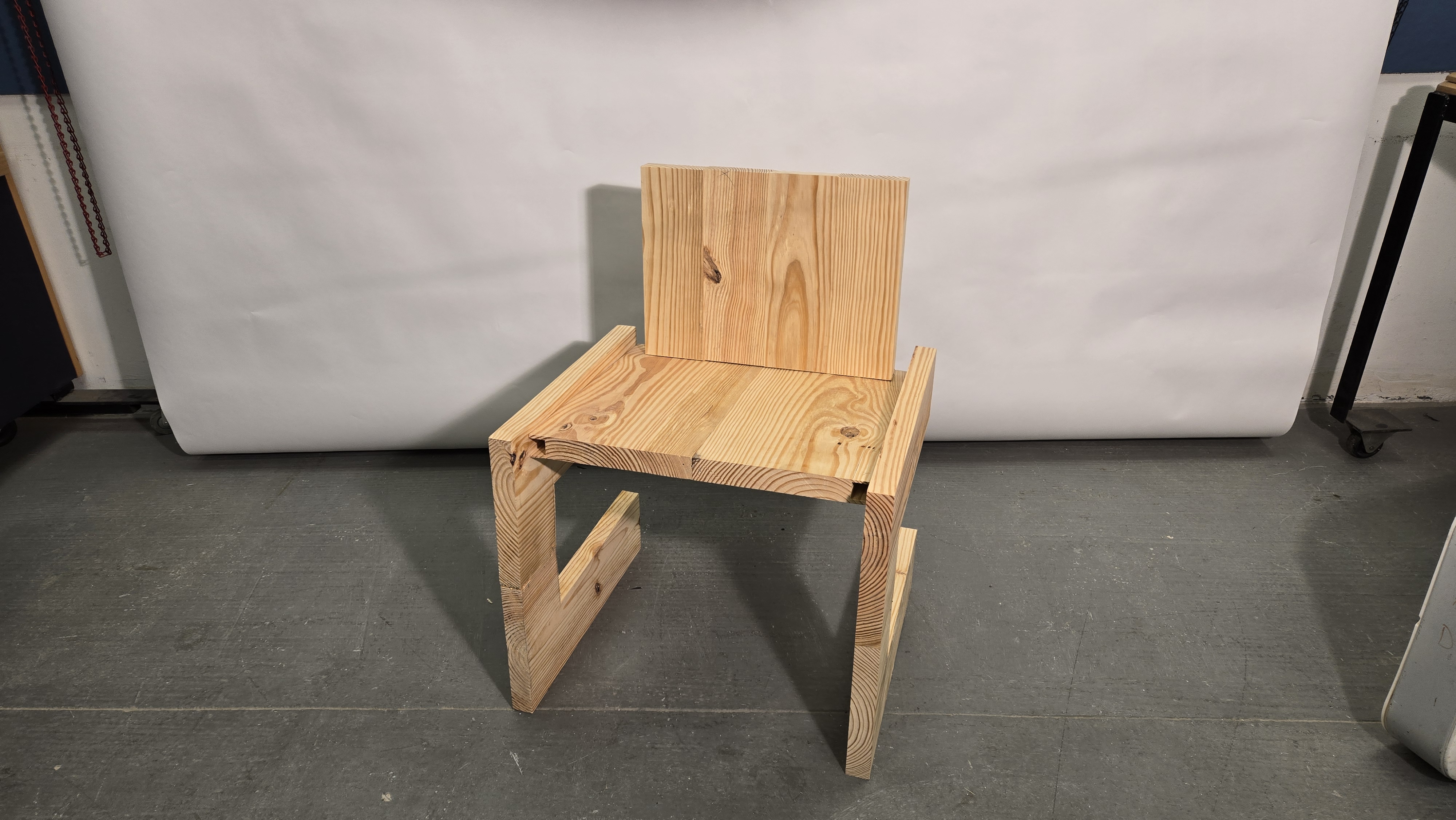 Full-scale wood chair prototype in the shop