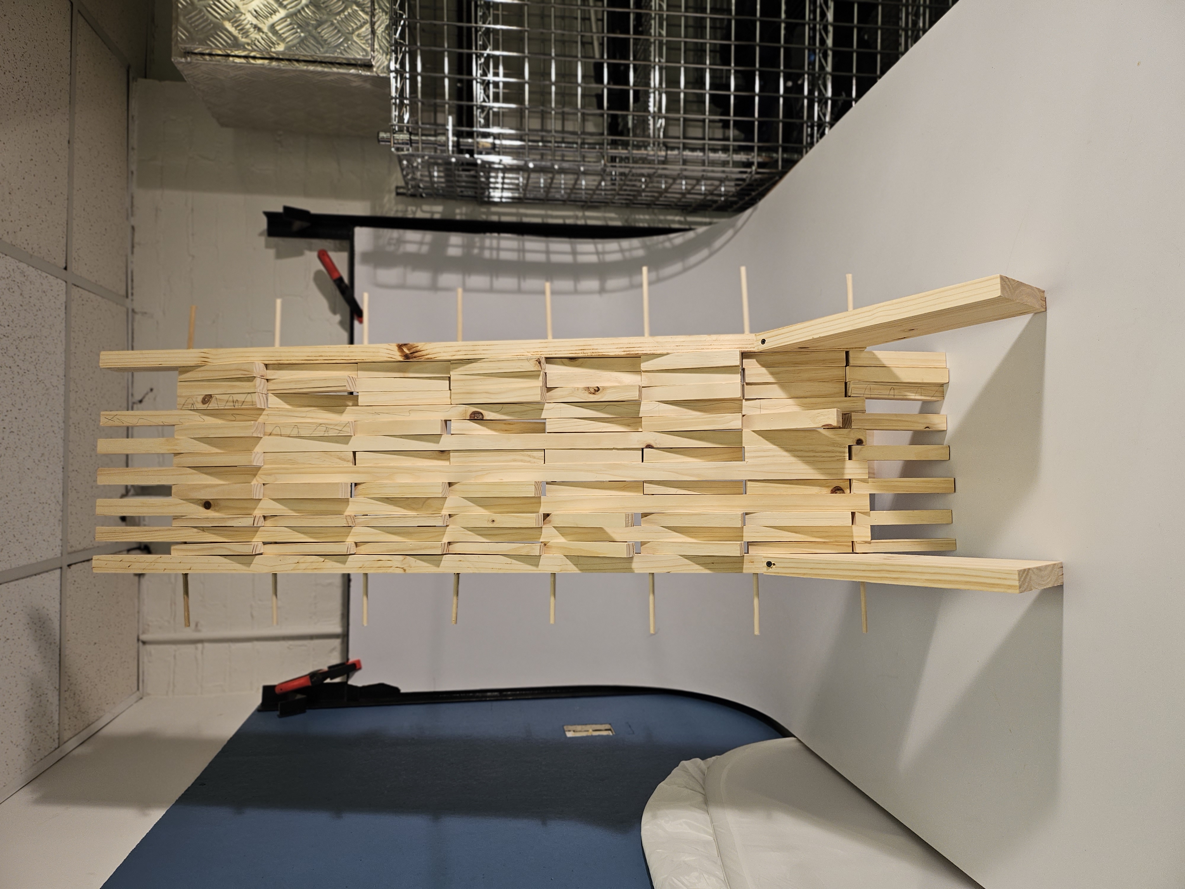 Physical scale model — lean geometry and slatted panel