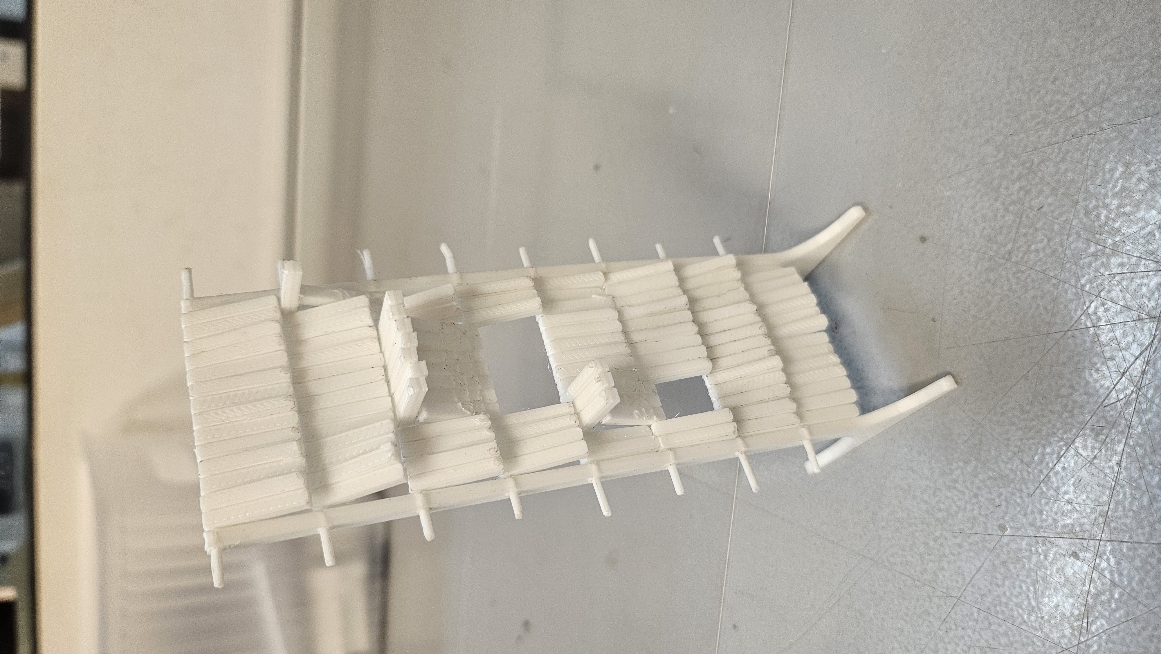 FDM scale prototype — top view showing full lean geometry and rod slots