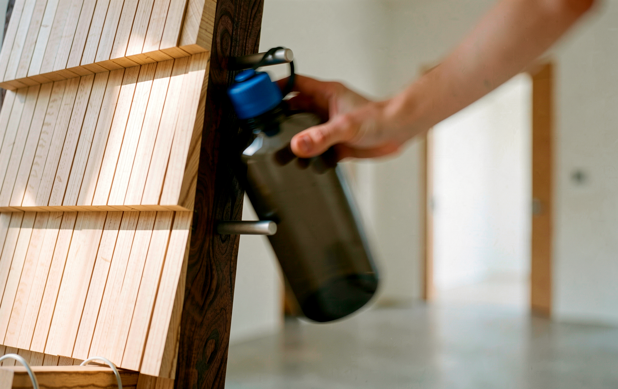 Water bottle held on mid-frame rod
